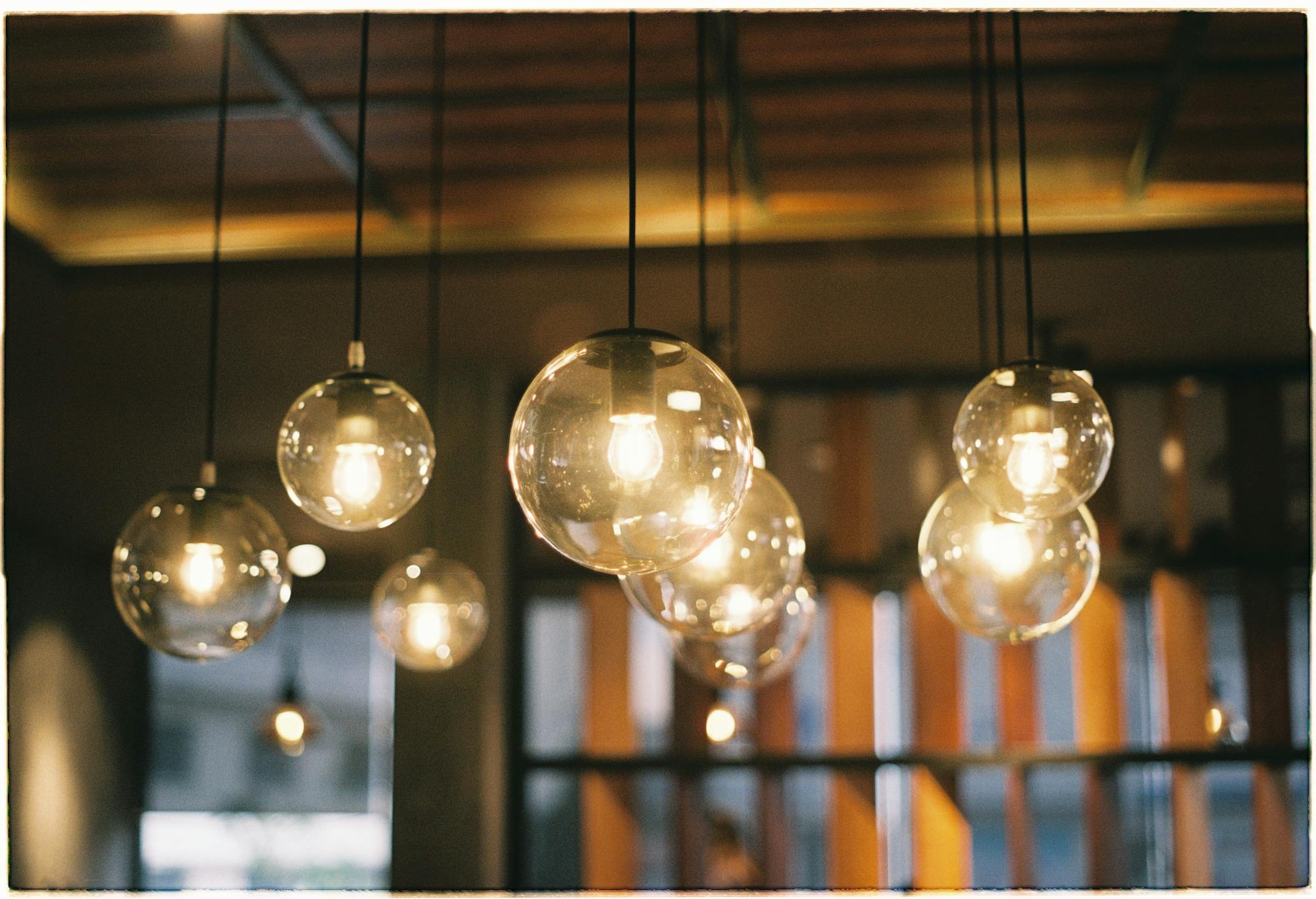 Warm hanging light bulbs in a calm indoor setting