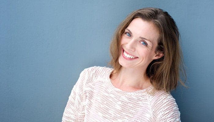 Smiling woman portrait for hypnotherapy weight loss article