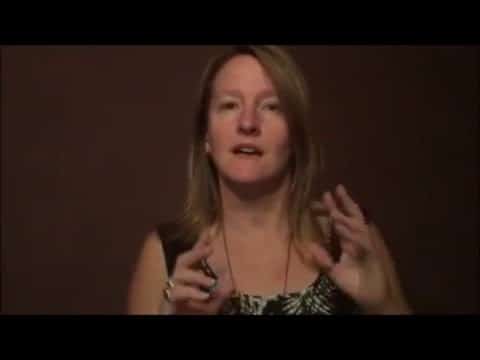 Woman speaking on camera about hypnotism.