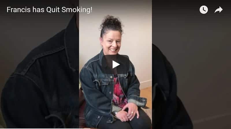 Woman smiling in a video about quitting smoking.